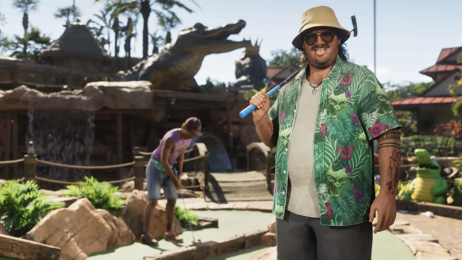 Moustached man at a tropical mini-golf course, putter on shoulder, giant gator prop behind