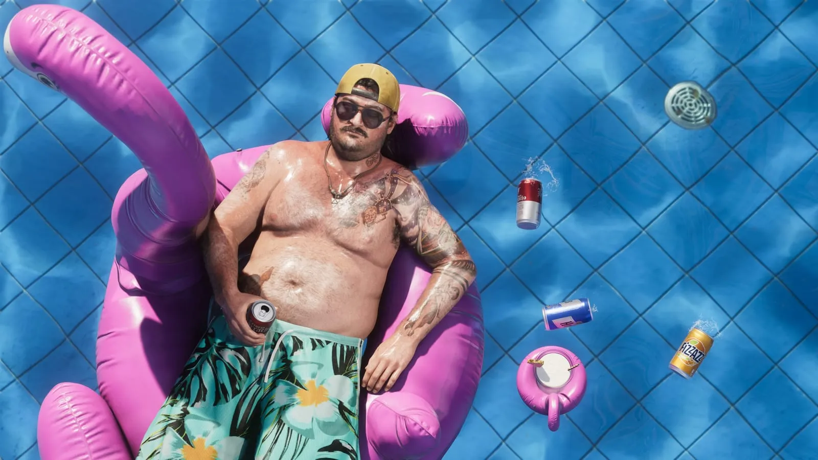 Overhead shot of a man drifting on a pink flamingo float, beer cans bobbing nearby