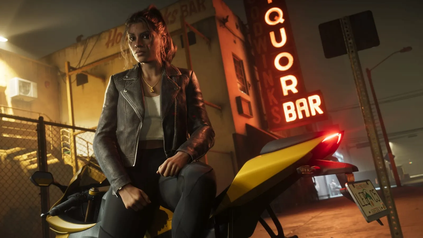 Young woman in a leather jacket on a yellow motorcycle outside a neon bar sign at night
